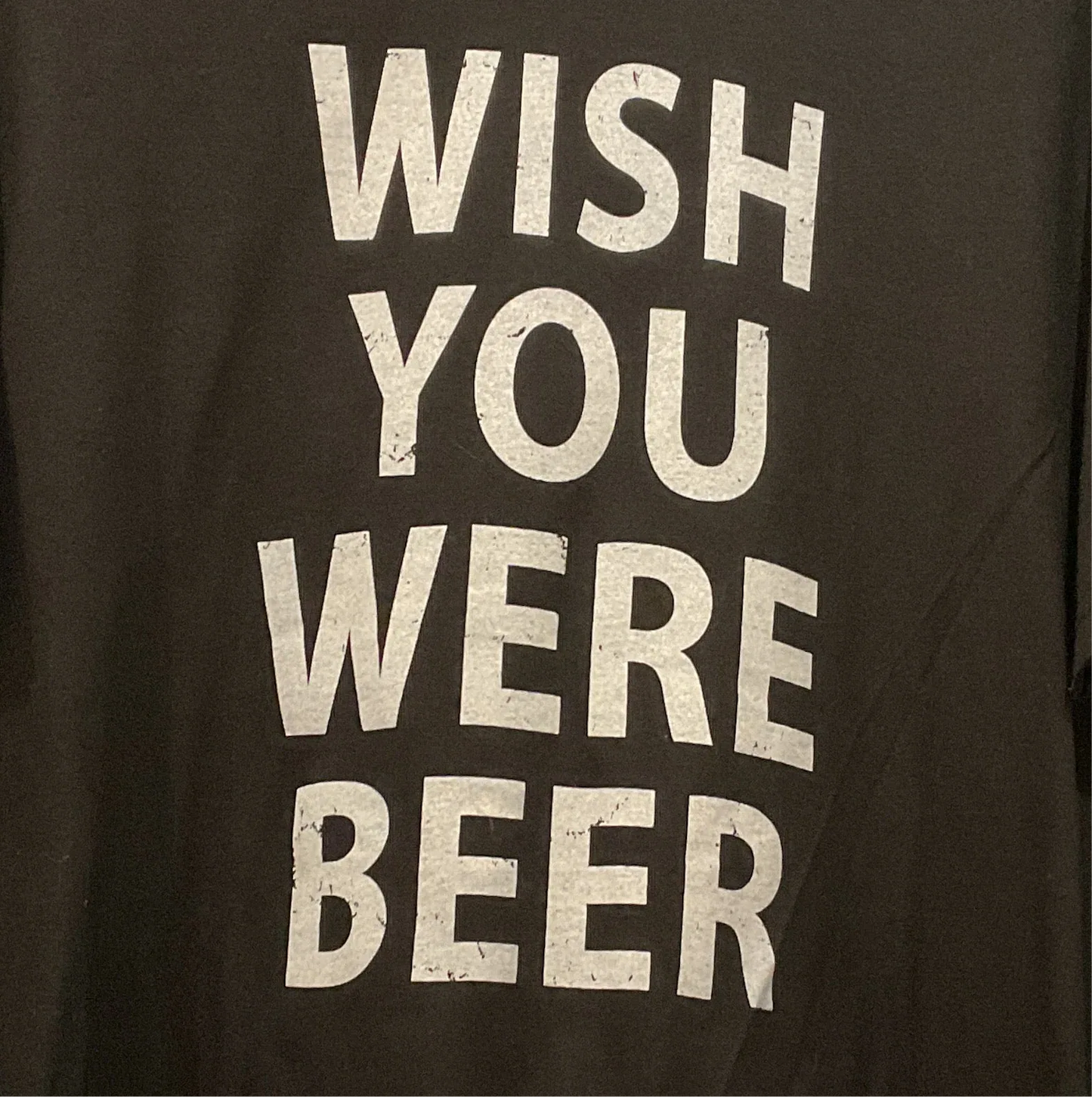 Black tee close-up: Wish You Were Beer print