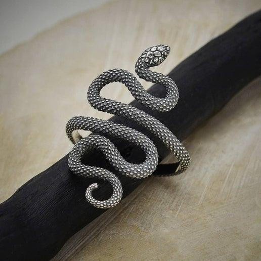 Textured adjustable snake ring with braided metal look, dark silver tone