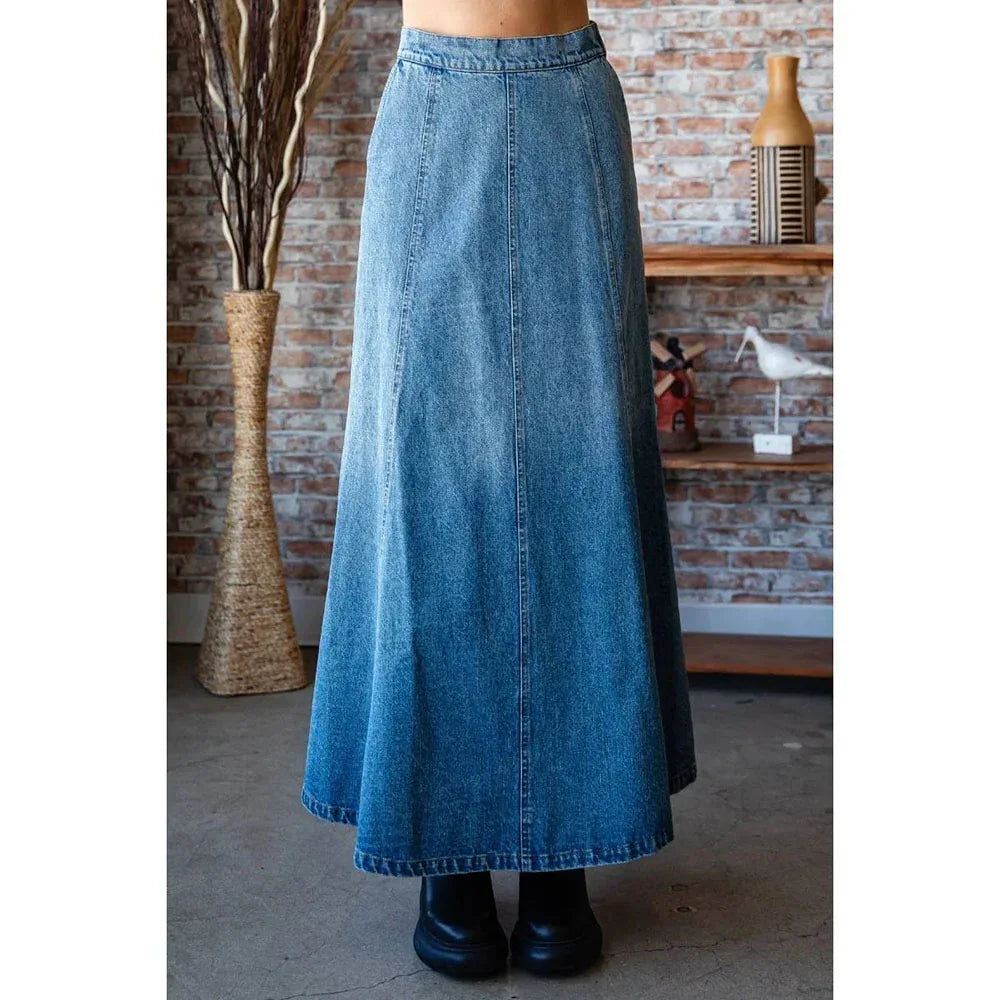 Medium wash A-line denim skirt side/back view with paneled flare and belt loops