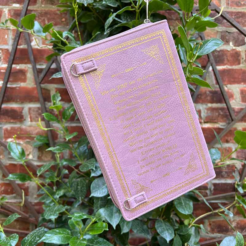 Back of Lilac Alice in Wonderland storybook purse with excepert