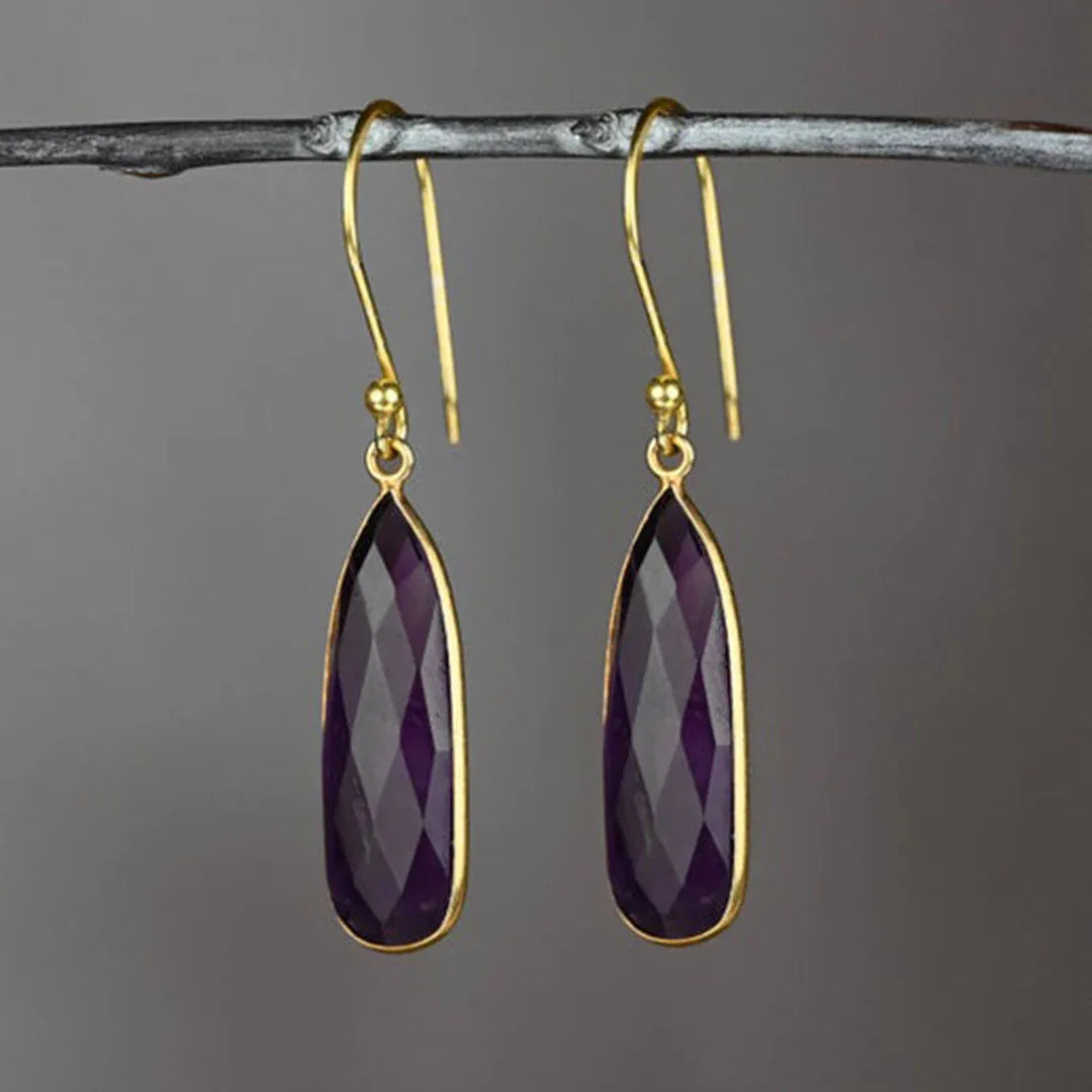 Purple amethyst teardrop earrings with faceted drop and gold-tone hooks