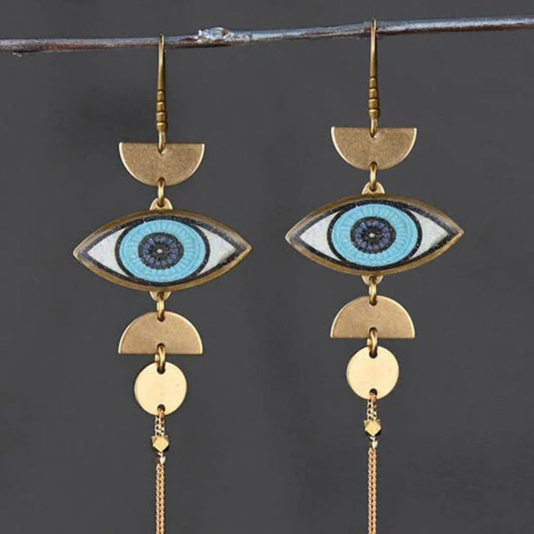 Brass long drop earrings with blue evil-eye and half-moon charms.