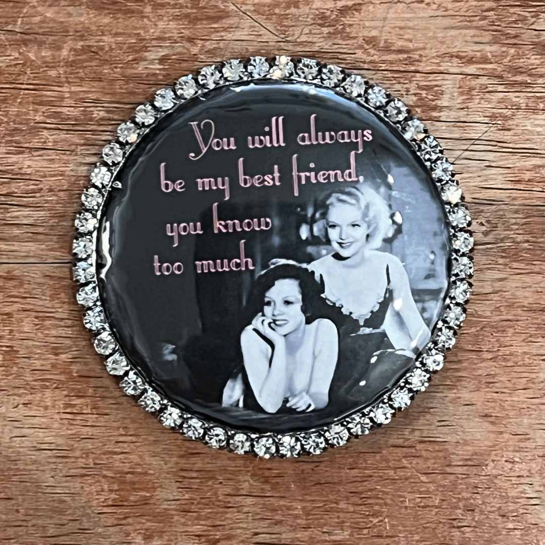 Round magnet with vintage photo and text on a wooden surface