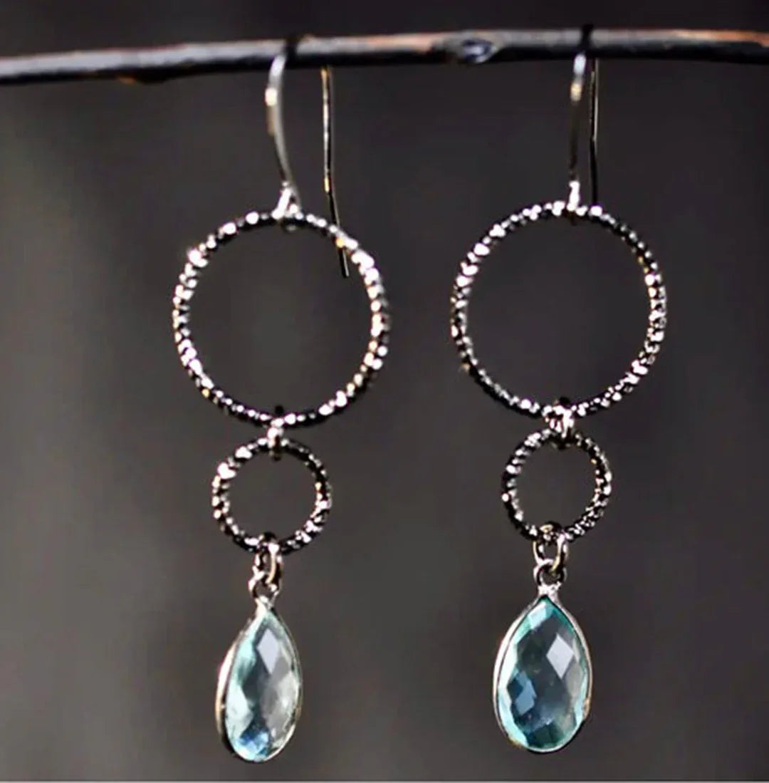 Gunmetal double-circle drop earrings with London blue teardrop pendants