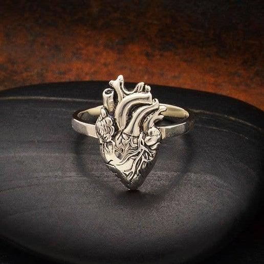 Sterling-silver anatomical heart ring with raised heart detail on band
