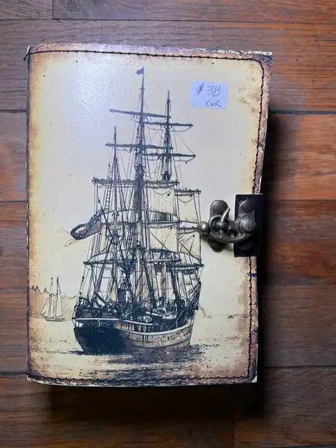 Spiritual journal cover with large sailing ship illustration, metal clasp on right