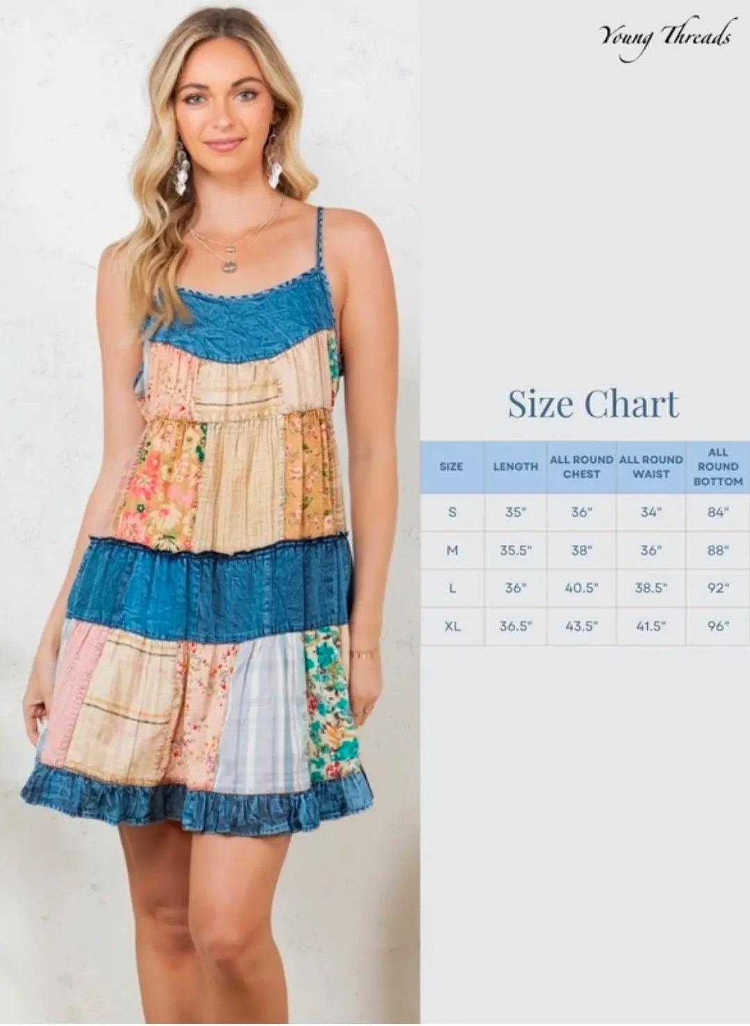 Woman wearing a colorful patchwork dress with a size chart on a white background. The dress is Boho floral summer dress outfit featuring a tiered patchwork sundress with vintage vubes and a touch of soft denim.