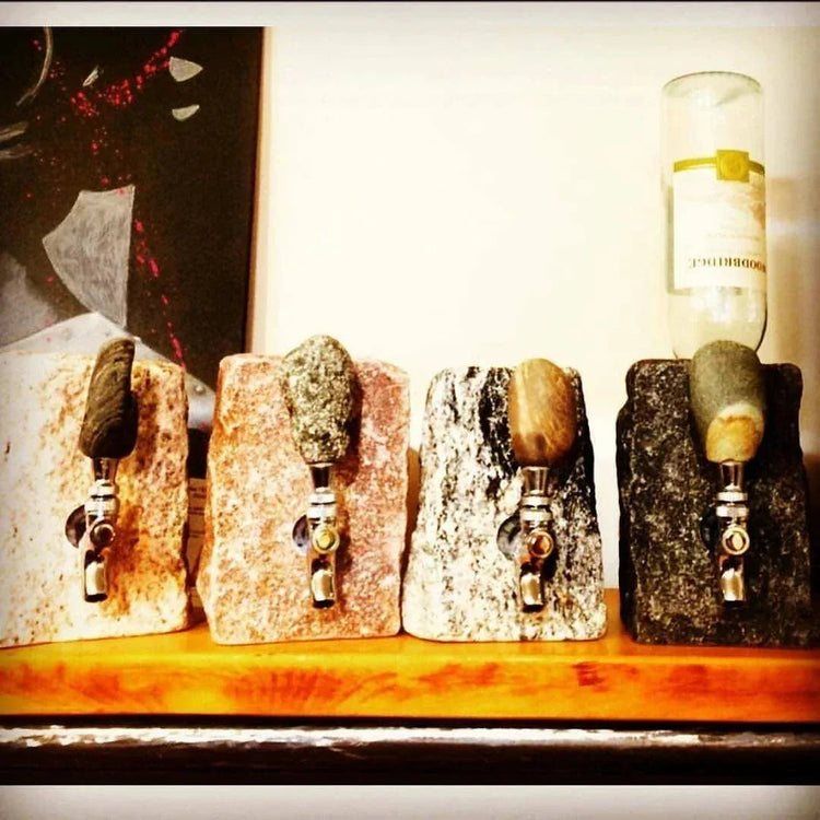 The cover photo for the unique gifts at Urban Princess Features a handcrafted upcycled wood shelf and the coveted gift of their popular handmade, artisan cobblestone granite wine tap. 
