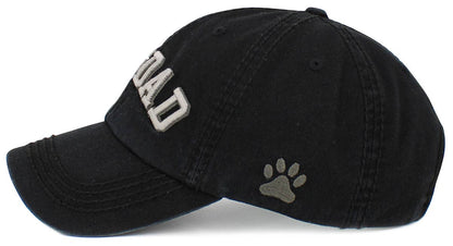 Black washed cap with paw print graphic on side and curved brim