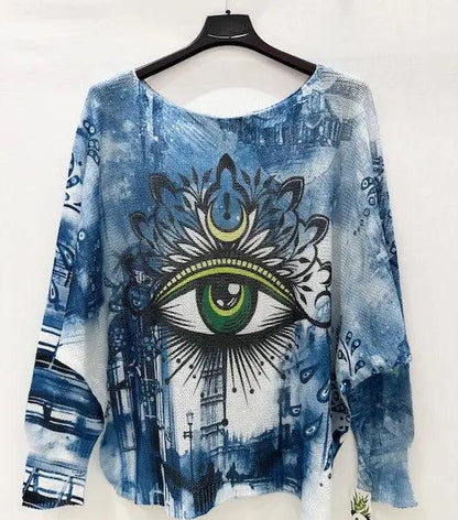 Light blue printed sweater with close-up green eye motif, wide boat neck