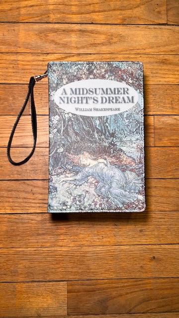 Book cover of 'A Midsummer Night's Dream' by William Shakespeare on a wooden surface
