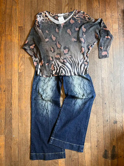Dark wash snakeskin-print jeans, front seam detail