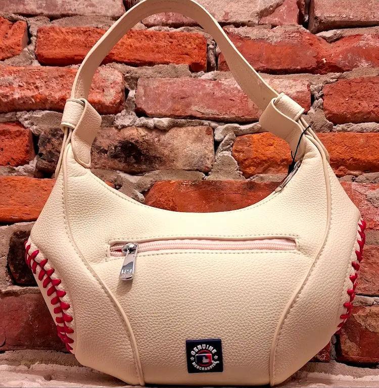 White hobo bag with red baseball stitching, front zipper pocket, and top handles