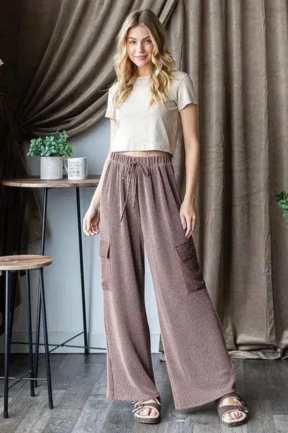 Ribbed cargo pants waistband and fit detail. Soft drapey pants paird with a white cropped top