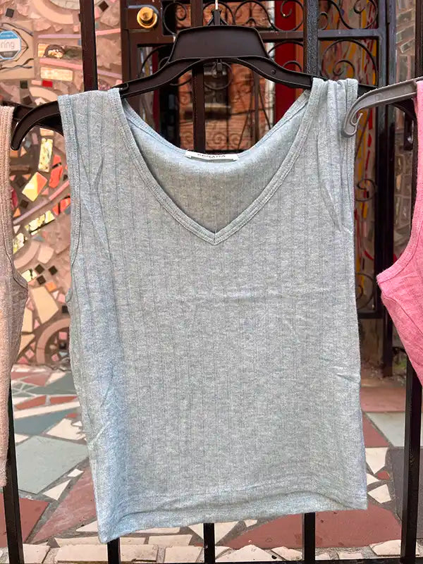 Light blue-gray ribbed crop tank with V-neck on hanger