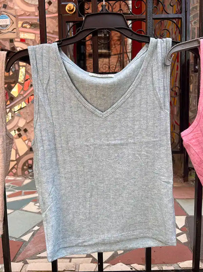Light blue-gray ribbed crop tank with V-neck on hanger
