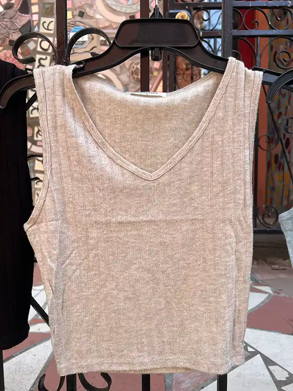 Beige ribbed crop tank with V-neck on hanger