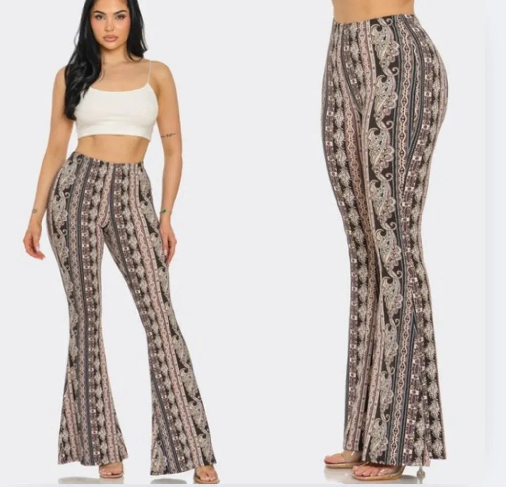 Baroque flare legging pants with vertical ornate print, dark base and pink accents
