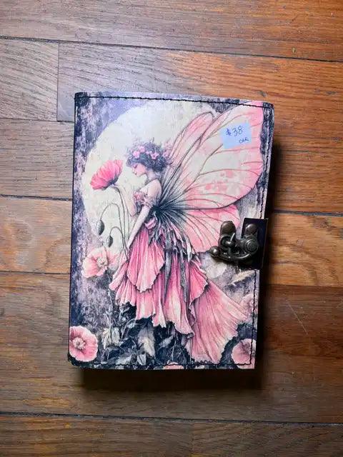Spiritual journal cover with pink fairy and floral illustration, metal clasp at right