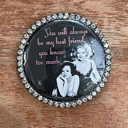 Round magnet  with vintage photo and text on a wooden surface