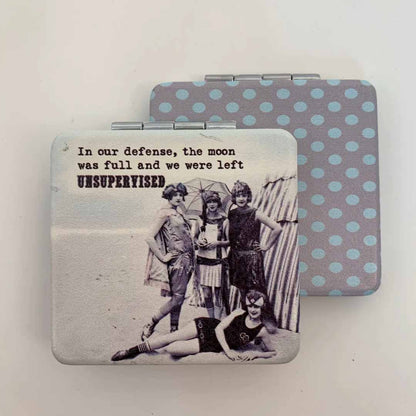 Compact mirror with vintage photo and humorous text on a light background