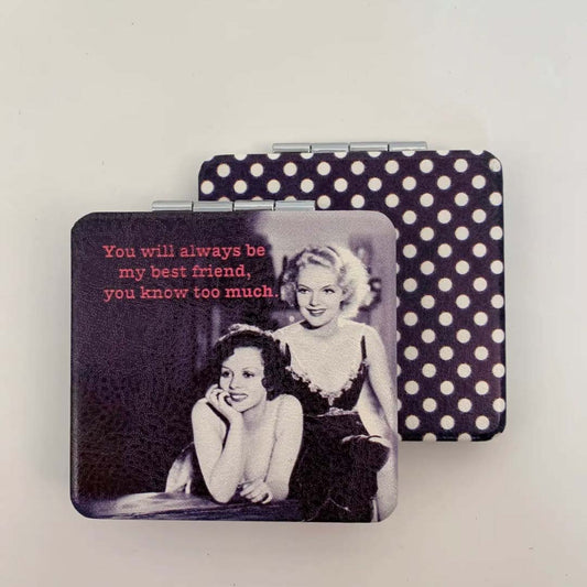 Compact mirror with polka dot design featuring a vintage photo of two women and a quote.
