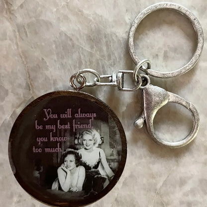 Keychain with vintage-style photo and text on a marble surface