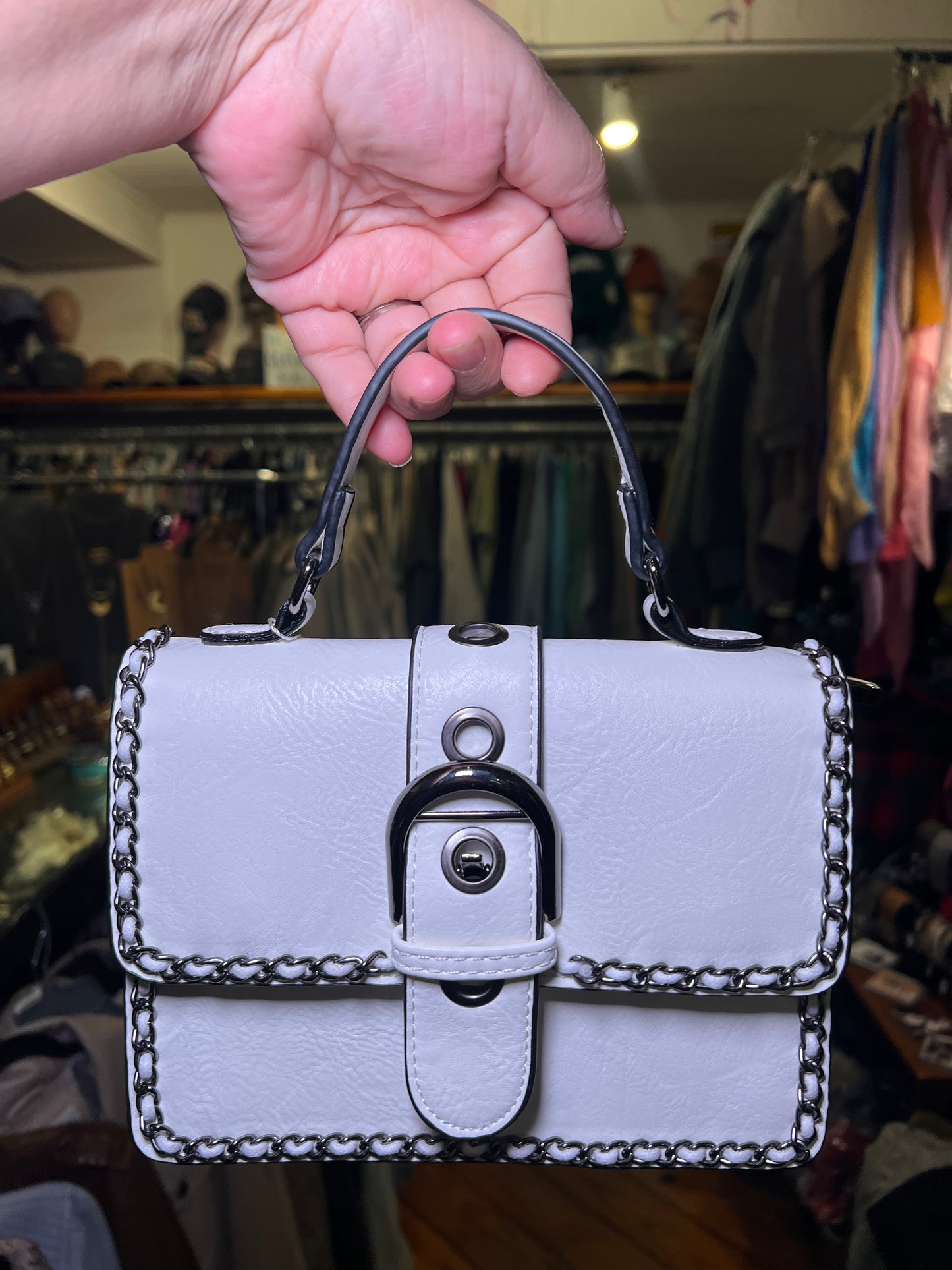 Chain-trimmed classic edge handbag, white faux-leather flap with lock clasp