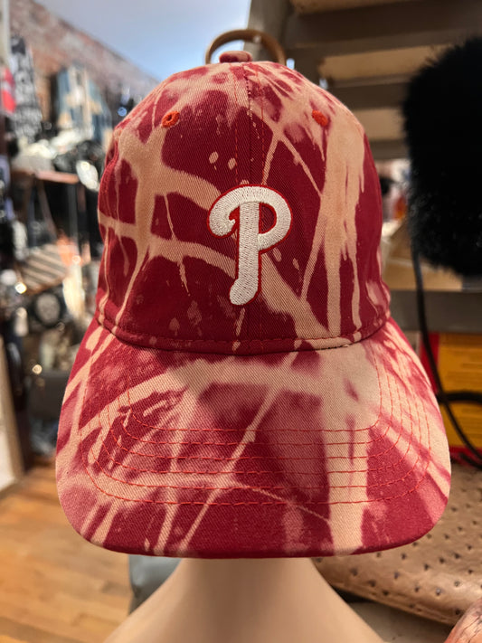 Red tie-dye baseball cap with Phillies P logo on front