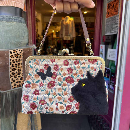Timeless kisslock clutch bag with interchangeable chain crossbody strap, with embroidered floral background, black cat and butterfly