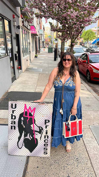 Dark denim maxi dress outfit styled with a Phillies tote bag on 4th and South Streets in Queen Village