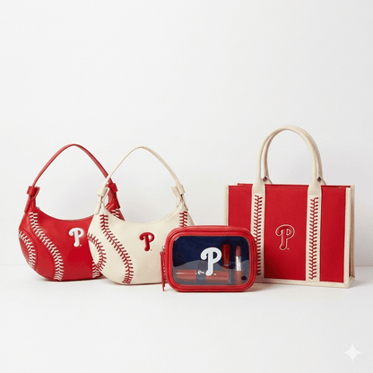 Licensed MLB Philadelphia Phillies handbags on a white background. 1 clear fanny pack with red case and red guitar strap. a red and a white hobo bag with baseball stitching and a stitched red and white tote bag.  they all have crossbody straps inside.