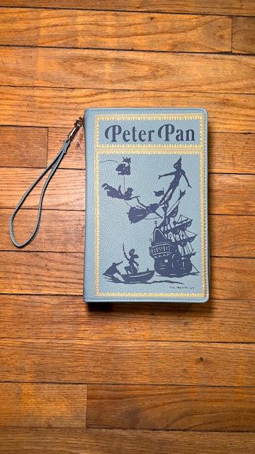 Wristlet with 'Peter Pan' design on a wooden surface