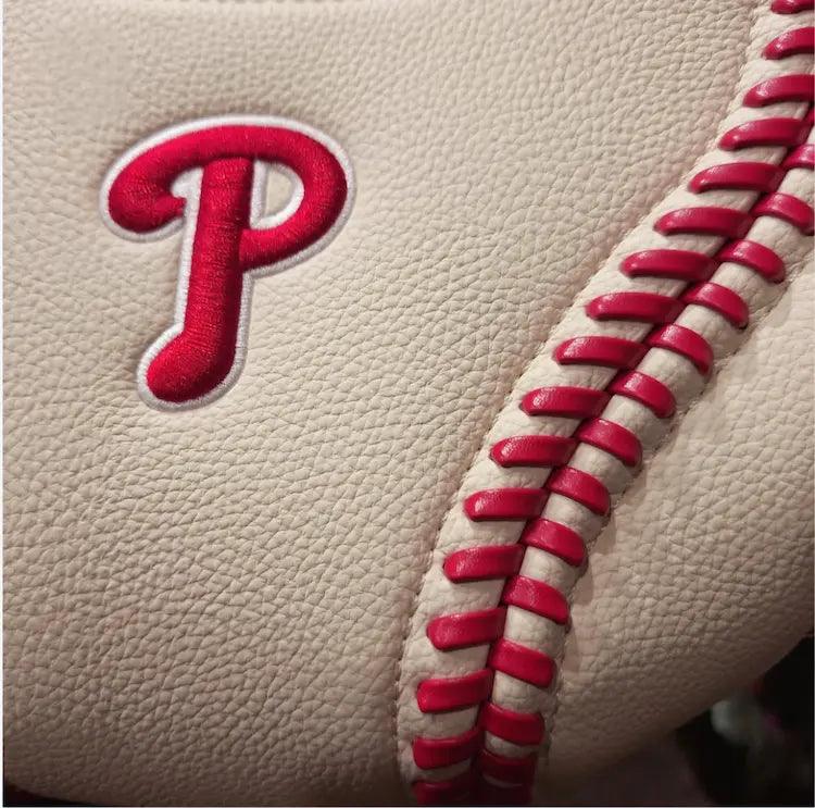 White hobo bag detail: red Phillies P patch and red baseball-style lacing