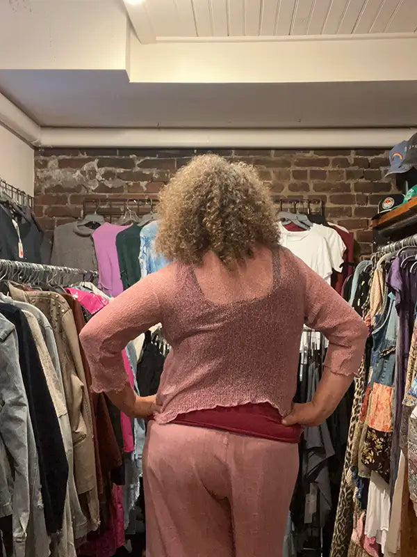 Mauve knit shrug with short sleeves and open front, cropped length
