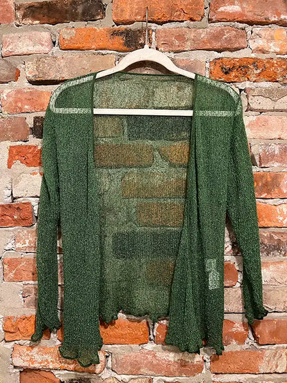 Green textured shrug with open front, long sleeves, and scalloped hem edge.