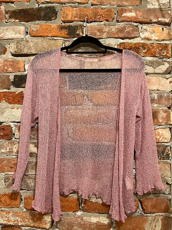 Mauve textured shrug with open front and long sleeves, scalloped hem.