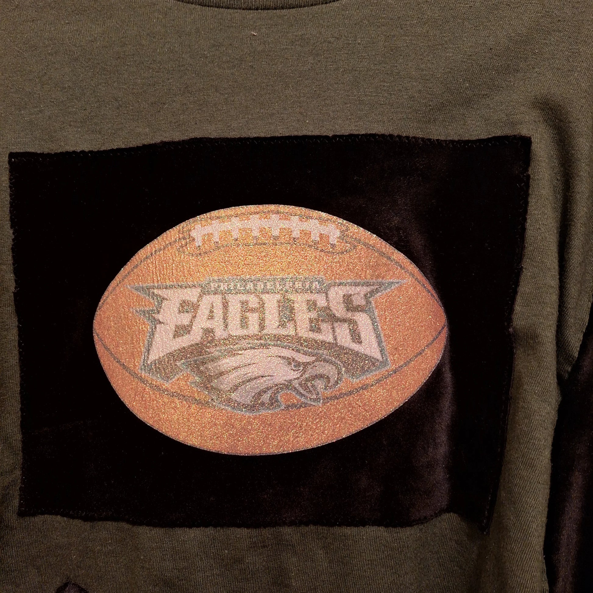 Sparkly Eagles Football Patch. This is a closeup of the front of the Eagles Poncho