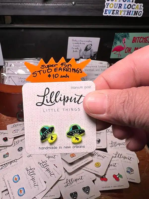 Yin-yang stud earrings with green cat and black border enamel