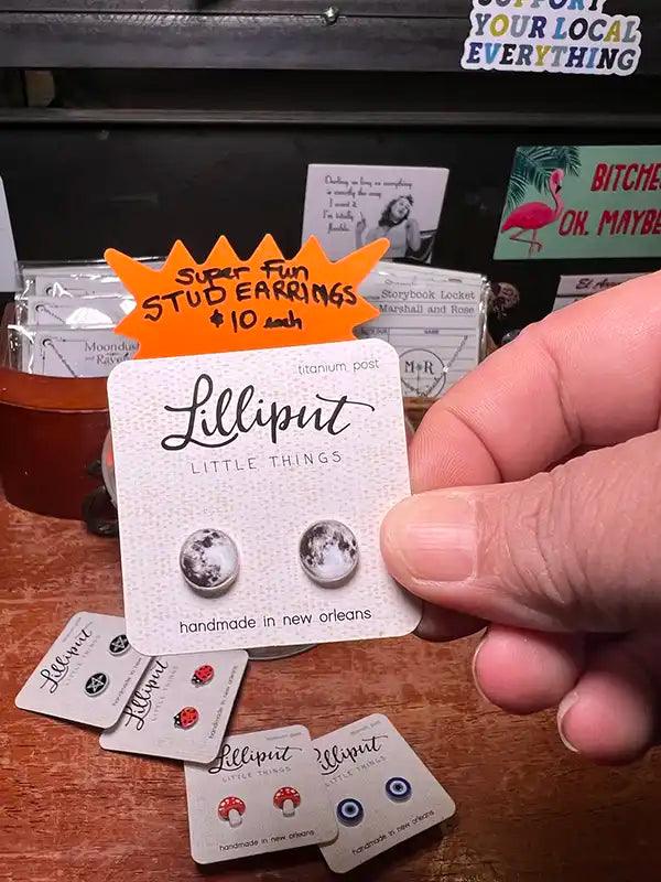 Novelty stud earrings with speckled silver round disc charms