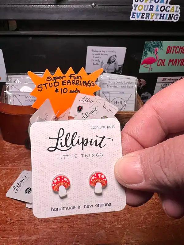 Novelty stud earrings with red and white mushroom charms