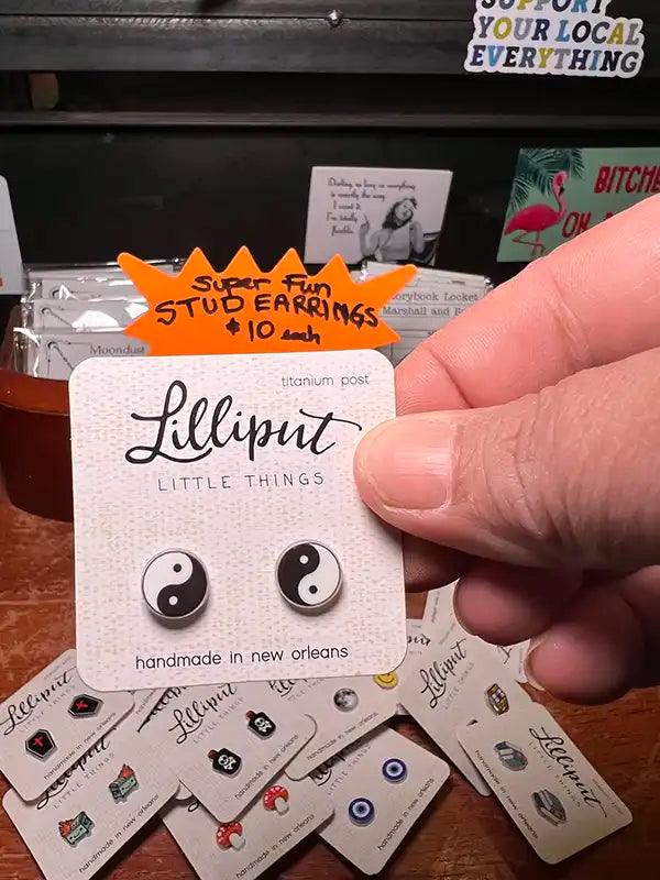 Yin-yang stud earrings with yin-yang symbols in black and white enamel