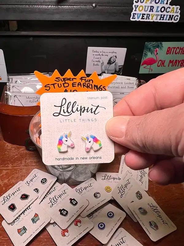 Novelty stud earrings with rainbow mane unicorn charms