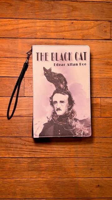 Wristlet with 'The Black Cat' by Edgar Allan Poe design on a wooden surface
