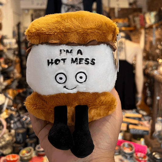 Hot Mess S'mores plushie: brown top, white face 'HOT MESS', big cartoon eyes