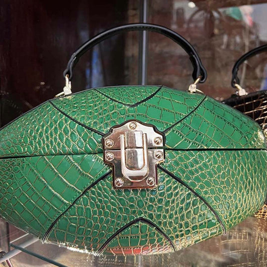 Front close up of philadelphia eagles green snake skin purse with veins of gold