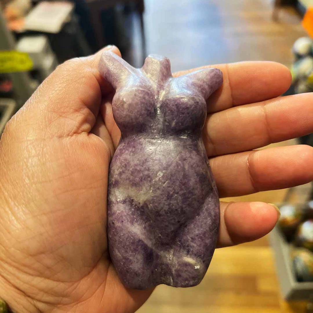 medium size lepidolite goddess in models hand