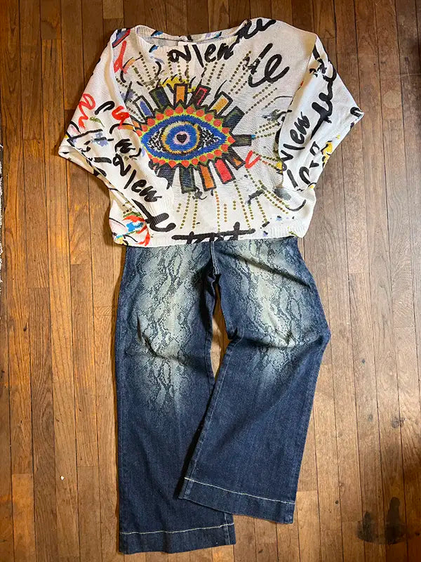 Dark wash snakeskin-print jeans with cuffed hem