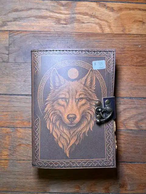 Spiritual journal cover with wolf head portrait and moon, metal clasp on right