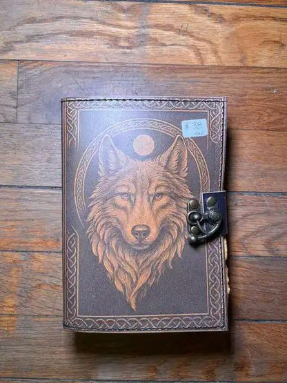 Spiritual journal cover with wolf head portrait and moon, metal clasp on right